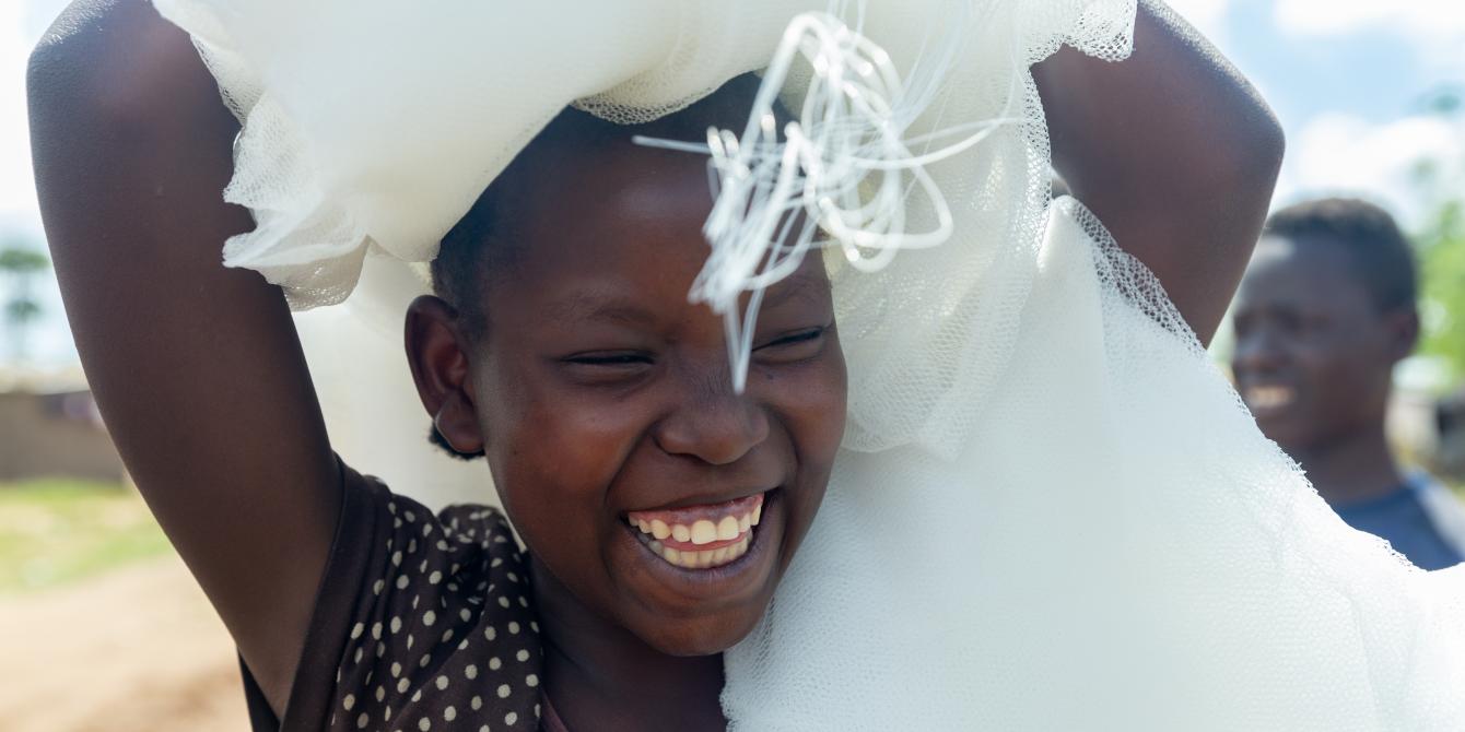 Esperanza, 16, after receiving a mosquito net in Kyakya II. “We depend on the external help here,” she says. Photo credit: Viktorija Jeras / Oxfam